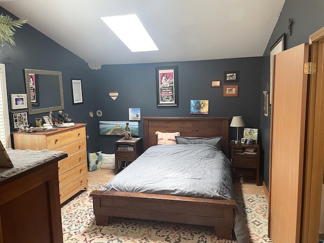 30W071 Kensington Dr, Warrenville, IL 60555 - bedroom with vaulted ceiling, light wood finished floors, and a skylight