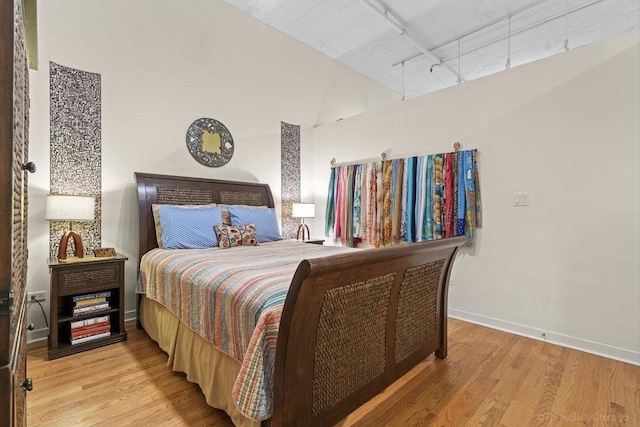 547 S Clark St Unit 704, Chicago, IL 60605 - bedroom featuring light wood finished floors, baseboards, and rail lighting