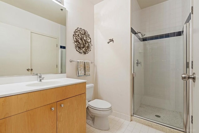 547 S Clark St Unit 704, Chicago, IL 60605 - bathroom with a shower stall, tile patterned floors, toilet, and vanity