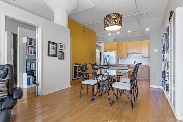 547 S Clark St Unit 704, Chicago, IL 60605 - dining room with light wood-style floors, track lighting, and baseboards