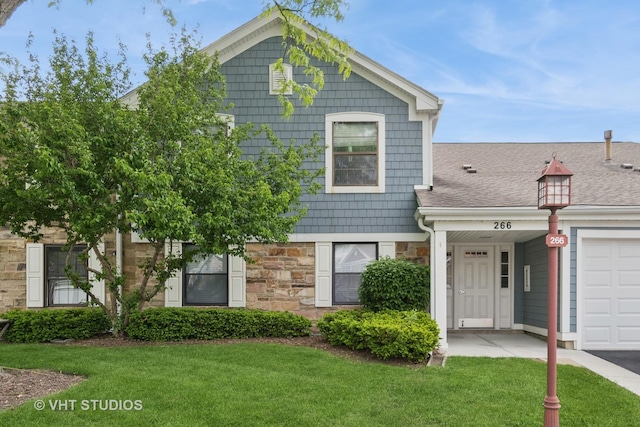 266 Mayfair Ln Unit C1, Schaumburg, IL 60193 - view of front facade with stone siding and a front lawn