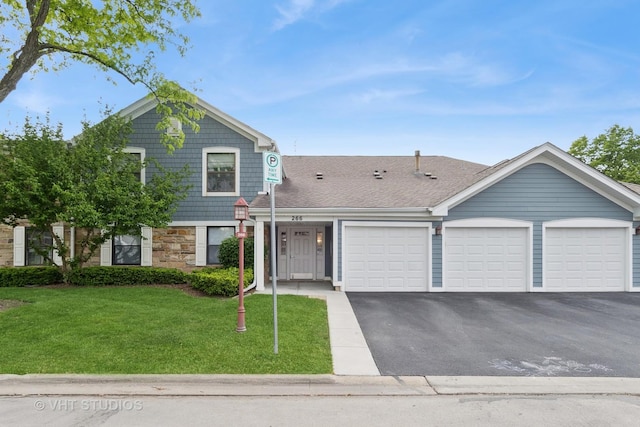 266 Mayfair Ln Unit C1, Schaumburg, IL 60193 - view of front of home with an attached garage, driveway, a front lawn, and stone siding