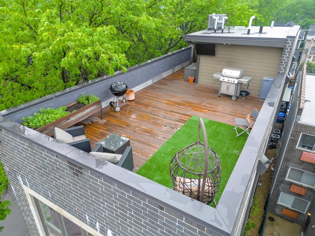 2256 W Foster Ave Unit 3, Chicago, IL 60625 - wooden deck with a grill