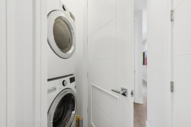 2256 W Foster Ave Unit 3, Chicago, IL 60625 - laundry room with stacked washing machine and dryer and wood finished floors