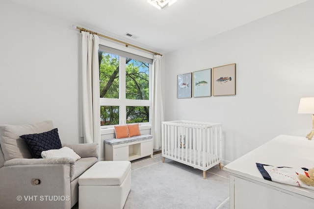 2256 W Foster Ave Unit 3, Chicago, IL 60625 - bedroom with a crib and light colored carpet