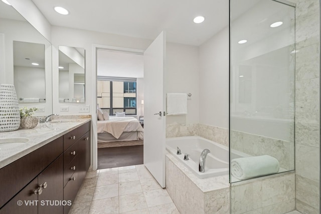 600 N Lake Shore Dr Unit 3411, Chicago, IL 60611 - bathroom featuring double vanity, ensuite bath, a bath, and recessed lighting
