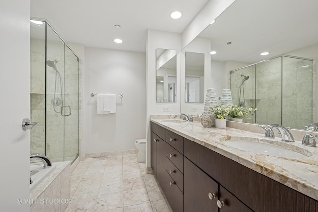 600 N Lake Shore Dr Unit 3411, Chicago, IL 60611 - bathroom with double vanity, recessed lighting, a shower stall, toilet, and baseboards