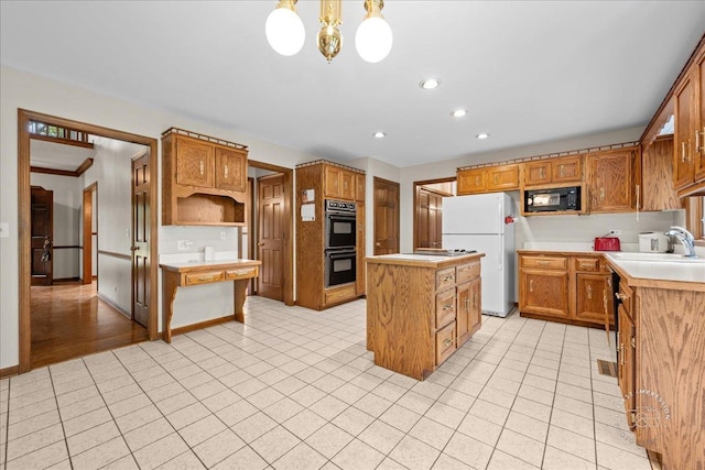 560 Braemar Ave, Naperville, IL 60563 - kitchen featuring black appliances, a center island, light tile patterned floors, light countertops, and recessed lighting