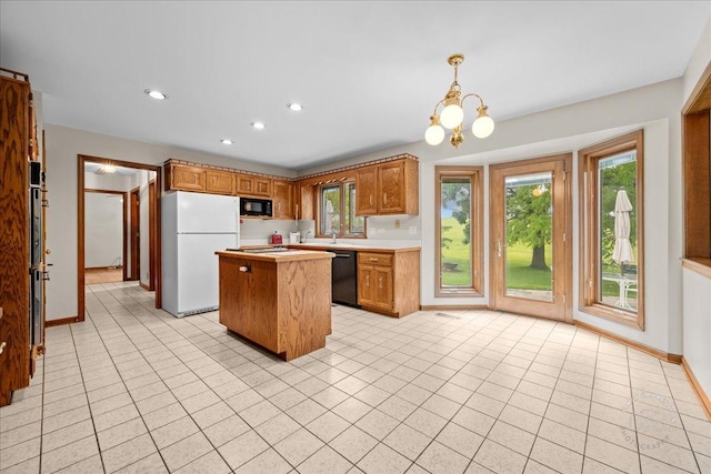 560 Braemar Ave, Naperville, IL 60563 - kitchen with black appliances, a center island, light countertops, brown cabinetry, and recessed lighting