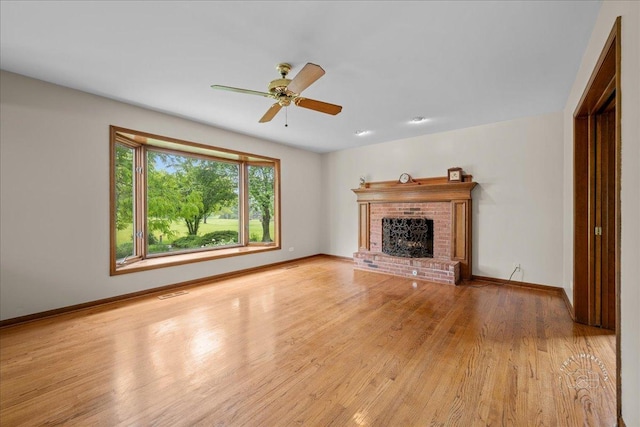 560 Braemar Ave, Naperville, IL 60563 - unfurnished living room with wood finished floors, a brick fireplace, and ceiling fan