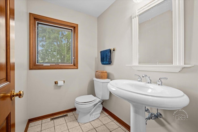 560 Braemar Ave, Naperville, IL 60563 - half bathroom featuring baseboards and tile patterned floors