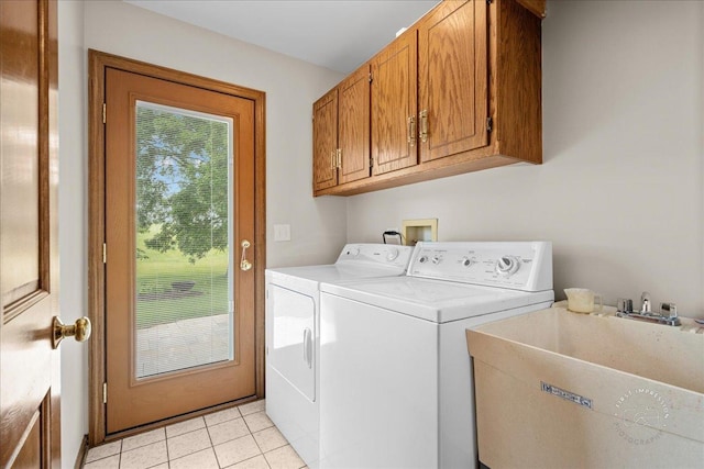 560 Braemar Ave, Naperville, IL 60563 - washroom featuring cabinet space, separate washer and dryer, and light tile patterned flooring