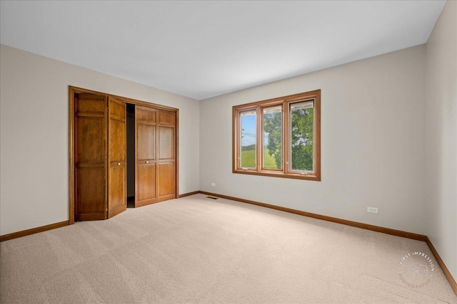 560 Braemar Ave, Naperville, IL 60563 - unfurnished bedroom featuring carpet floors and a closet