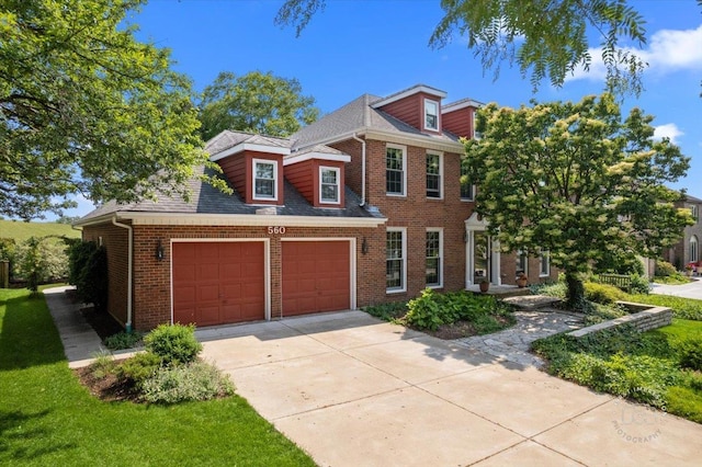 560 Braemar Ave, Naperville, IL 60563 - view of front of home featuring driveway, brick siding, a garage, and a shingled roof