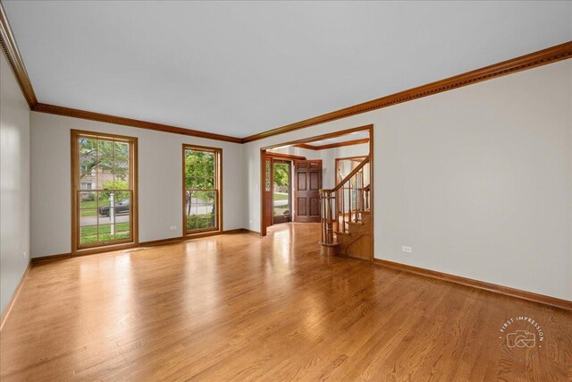 560 Braemar Ave, Naperville, IL 60563 - unfurnished living room with ornamental molding, light wood-type flooring, and stairway