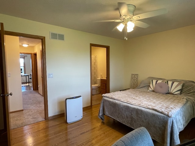 1181 Golf Ct, Dekalb, IL 60115 - bedroom featuring light wood-type flooring, baseboards, ensuite bath, and ceiling fan