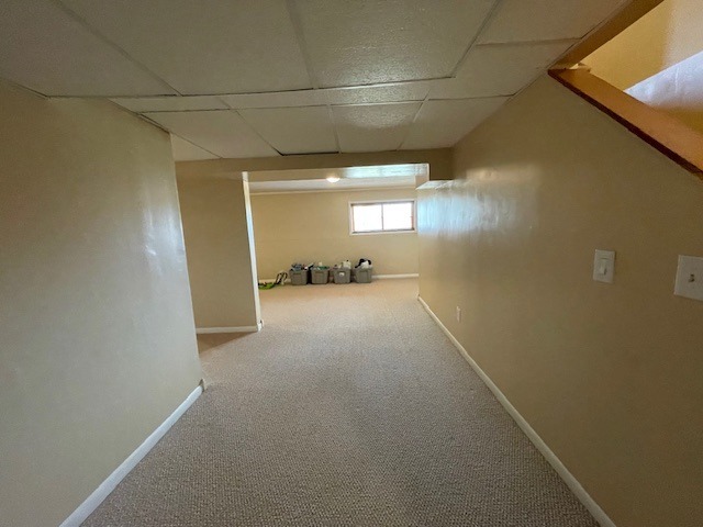 1181 Golf Ct, Dekalb, IL 60115 - corridor with a drop ceiling, carpet floors, and baseboards