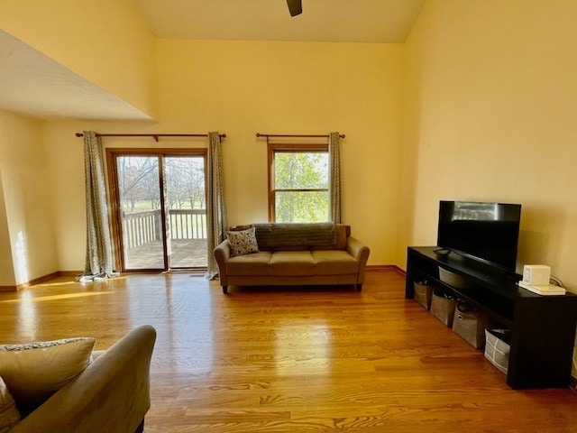 1181 Golf Ct, Dekalb, IL 60115 - living area featuring light wood-style flooring, a ceiling fan, and baseboards
