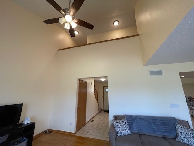 1181 Golf Ct, Dekalb, IL 60115 - living room with a ceiling fan, high vaulted ceiling, and light wood finished floors