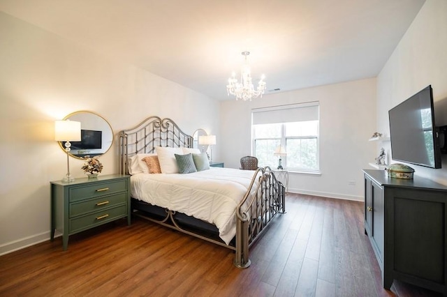 1950 Farnsworth Ln Unit 207, Northbrook, IL 60062 - bedroom featuring a chandelier, dark wood-style floors, and baseboards