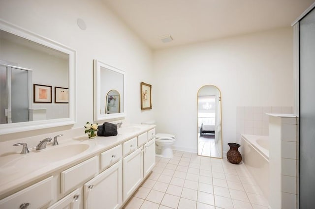 1950 Farnsworth Ln Unit 207, Northbrook, IL 60062 - bathroom featuring tile patterned floors, double vanity, a garden tub, toilet, and a shower with shower door
