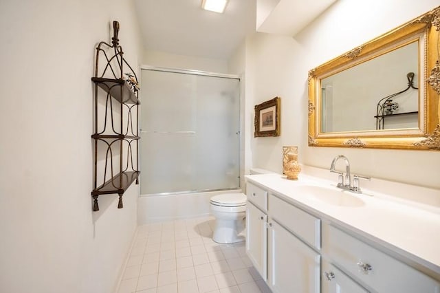 1950 Farnsworth Ln Unit 207, Northbrook, IL 60062 - bathroom featuring vanity, toilet, tile patterned floors, and shower / bath combination with glass door