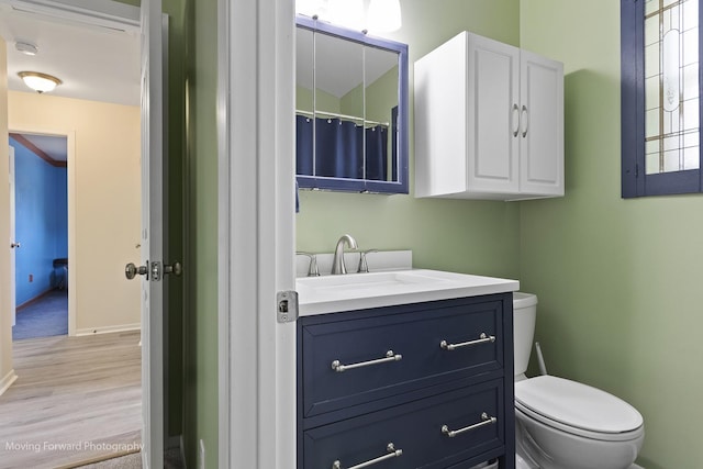 150 Meadows Ct, Sugar Grove, IL 60554 - bathroom featuring vanity, toilet, wood finished floors, and baseboards