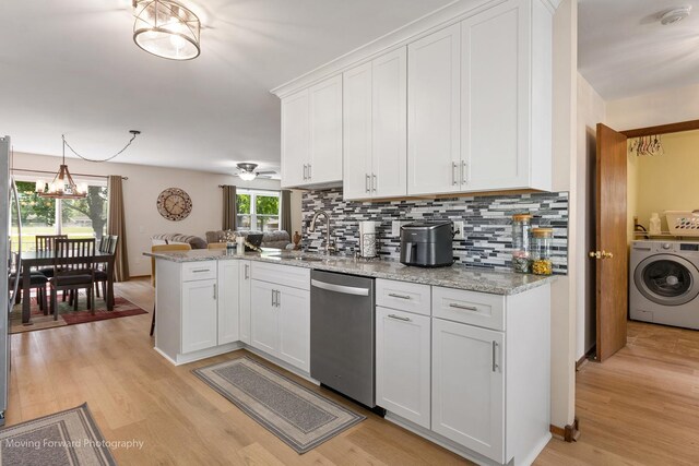 150 Meadows Ct, Sugar Grove, IL 60554 - kitchen with dishwasher, washer / clothes dryer, a sink, a peninsula, and backsplash