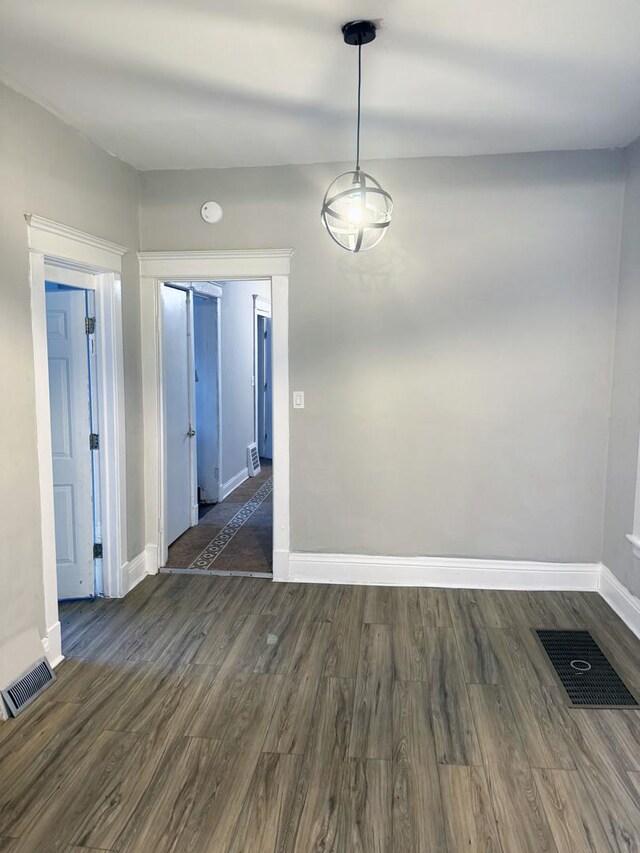 6529 S Laflin St, Chicago, IL 60636 - unfurnished dining area featuring baseboards and dark wood finished floors