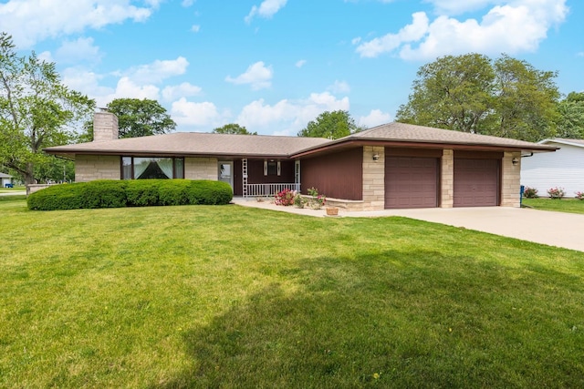 401 N 4th Ave, Chenoa, IL 61726 - view of front of house with an attached garage, driveway, a chimney, a front yard, and a porch