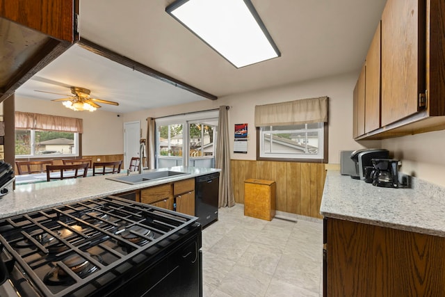 15424 David Ln, Oak Forest, IL 60452 - kitchen featuring dishwasher, gas stove, healthy amount of natural light, wood walls, and wainscoting