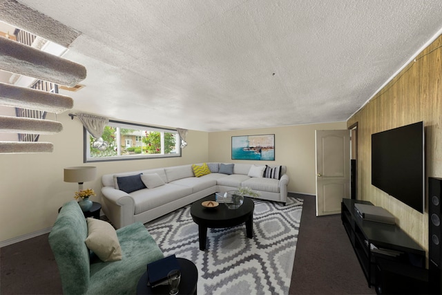 15424 David Ln, Oak Forest, IL 60452 - living area featuring wooden walls, a textured ceiling, and dark colored carpet