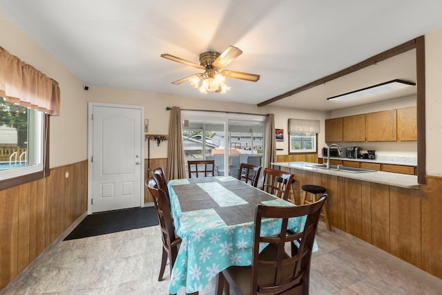 15424 David Ln, Oak Forest, IL 60452 - dining room featuring wooden walls, wainscoting, and a ceiling fan