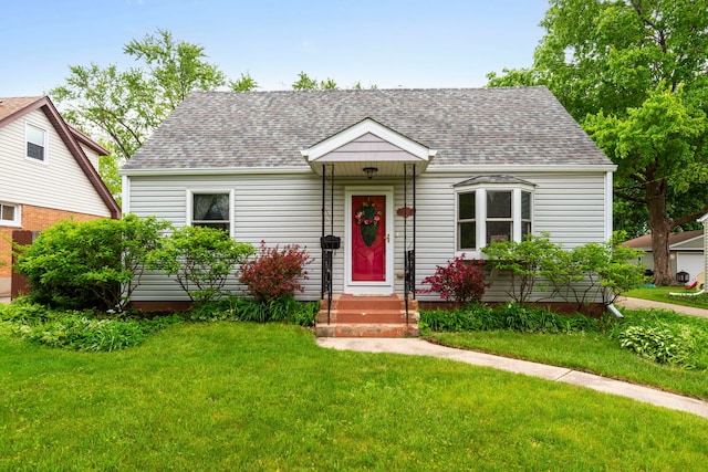 229 N Marion Ave, Bartlett, IL 60103 - view of front facade with roof with shingles and a front yard