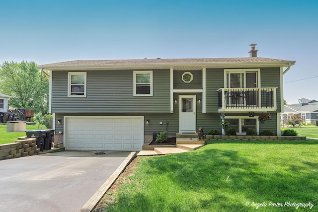 1503 Channel Beach Ave, Johnsburg, IL 60051 - bi-level home with an attached garage, concrete driveway, and a front yard