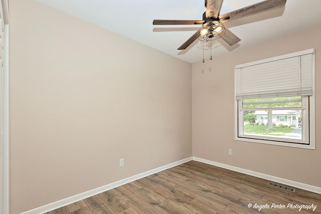 1503 Channel Beach Ave, Johnsburg, IL 60051 - unfurnished room featuring baseboards, wood finished floors, and ceiling fan