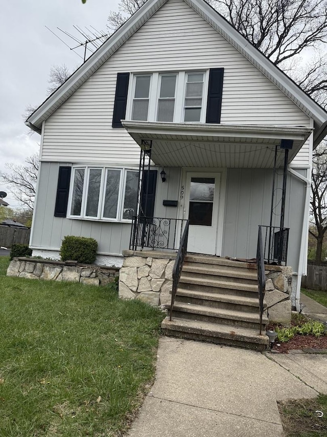 509 S May St, Joliet, IL 60436 - bungalow-style house featuring covered porch, board and batten siding, and a front yard