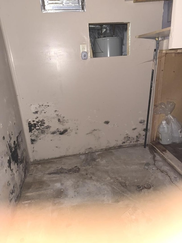 509 S May St, Joliet, IL 60436 - detailed view of water heater and unfinished concrete flooring