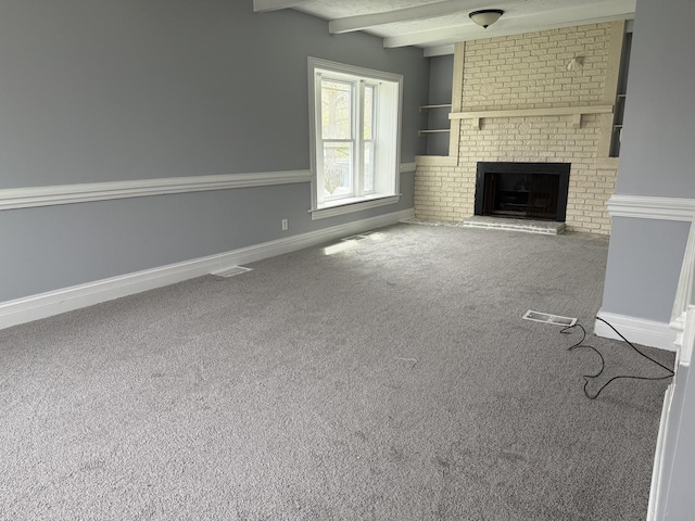 509 S May St, Joliet, IL 60436 - unfurnished living room featuring a fireplace, carpet flooring, beamed ceiling, and baseboards