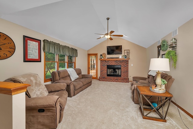 605 Feeney Dr, Minooka, IL 60447 - carpeted living room with a ceiling fan, vaulted ceiling, and a brick fireplace