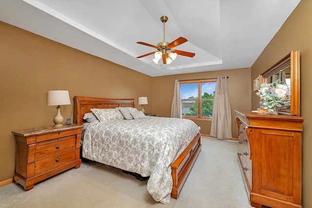605 Feeney Dr, Minooka, IL 60447 - bedroom with a raised ceiling, light carpet, baseboards, and a ceiling fan