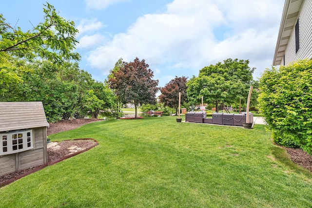 605 Feeney Dr, Minooka, IL 60447 - view of grassy yard with an outdoor hangout area and an outdoor structure