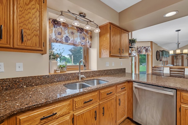 605 Feeney Dr, Minooka, IL 60447 - kitchen featuring dishwasher, a sink, dark stone counters, hanging light fixtures, and brown cabinets