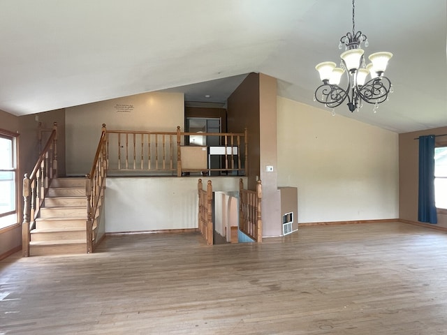 3400 N Buffalo Grove Rd, Arlington Heights, IL 60004 - stairs with vaulted ceiling, a chandelier, wood finished floors, and baseboards