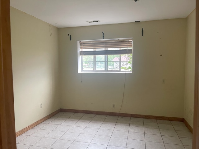 3400 N Buffalo Grove Rd, Arlington Heights, IL 60004 - spare room featuring baseboards and light tile patterned flooring