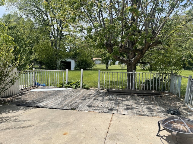 3400 N Buffalo Grove Rd, Arlington Heights, IL 60004 - view of patio featuring a fire pit, a wooden deck, and an outdoor structure