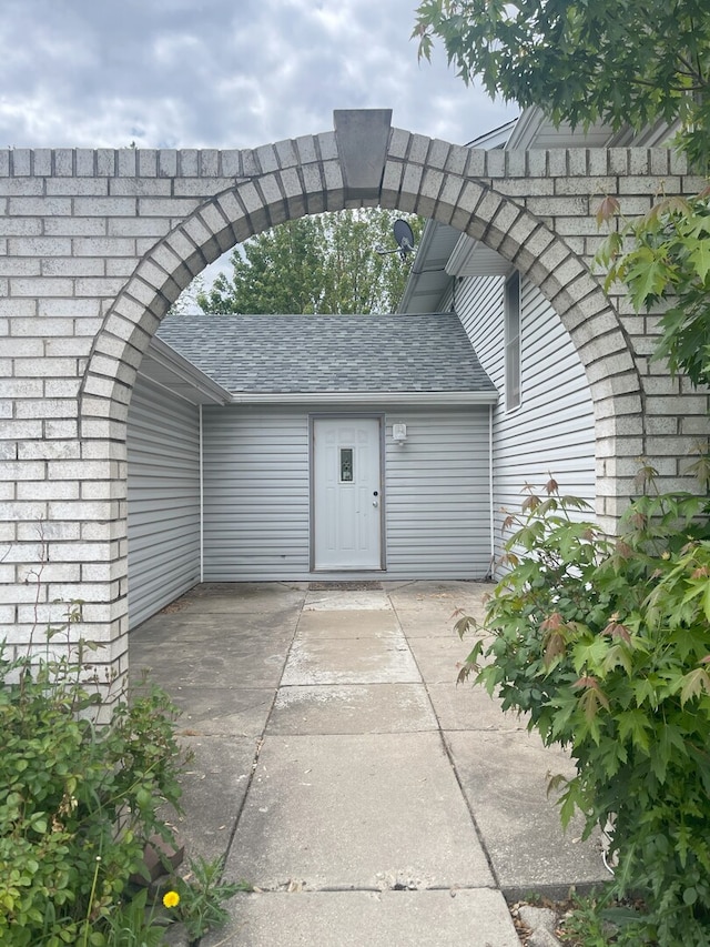 3400 N Buffalo Grove Rd, Arlington Heights, IL 60004 - view of exterior entry with roof with shingles and a patio