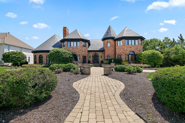 45 Silo Ridge Rd, Orland Park, IL 60467 - view of front of house with brick siding, a high end roof, a chimney, and stone siding