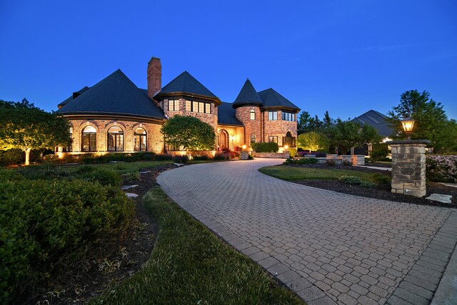 45 Silo Ridge Rd, Orland Park, IL 60467 - french provincial home with curved driveway, a chimney, and brick siding