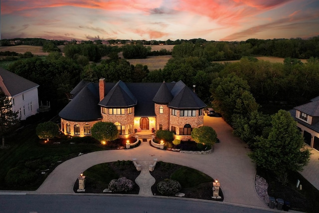 45 Silo Ridge Rd, Orland Park, IL 60467 - french country style house featuring curved driveway, stone siding, and a chimney